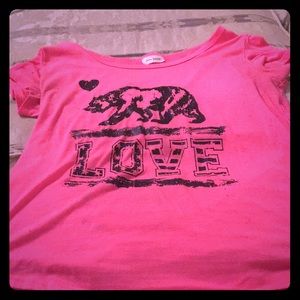 A pink shirt with design